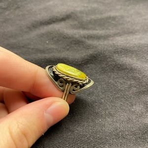 silver ring with green gem